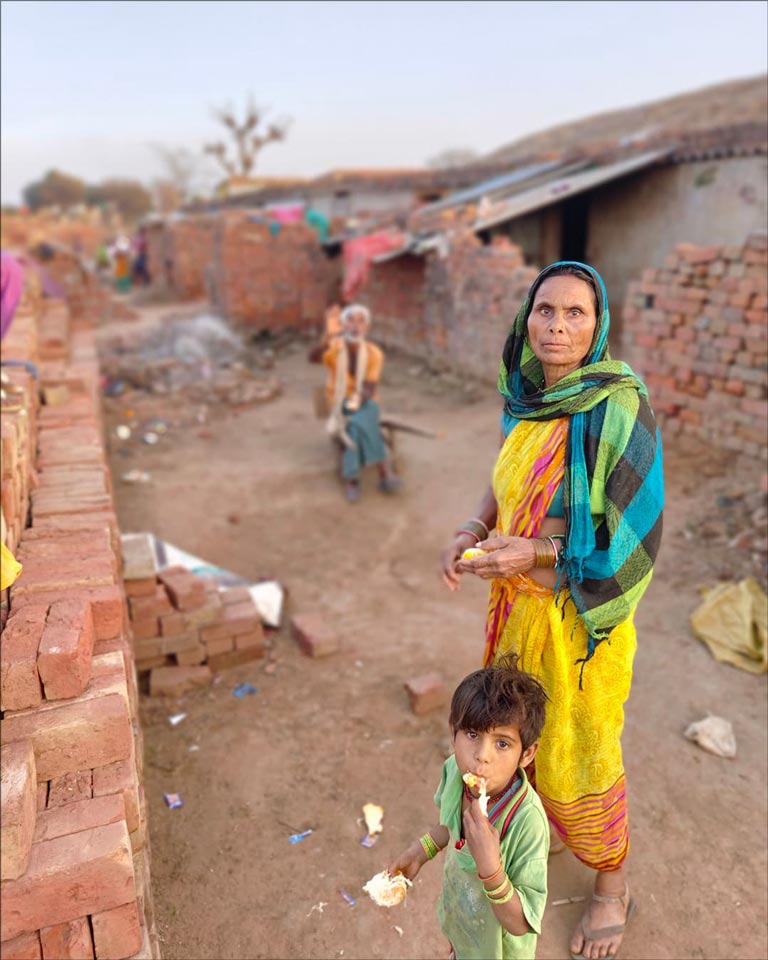 Baba's Feed Project recipient in the brick slum
